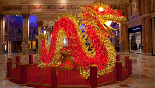 A 22-foot-long dragon, covered in 30,000 LED lights, is a tradition at the Forum Shops at Caesars.