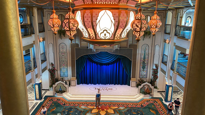 The atrium on the Disney Treasure features ornate lighting inspired by the movie "Aladdin."