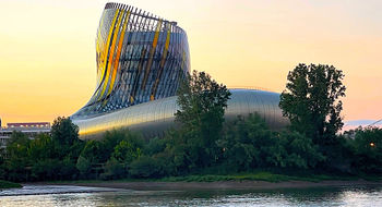 La Cite du Vin at sunset, as seen on a Garonne River dinner cruise.