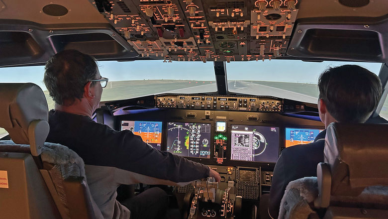 The author takes simulator instruction from a former Air Force pilot.