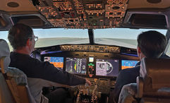 The author takes simulator instruction from a former Air Force pilot.