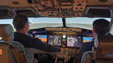 The author takes simulator instruction from a former Air Force pilot.