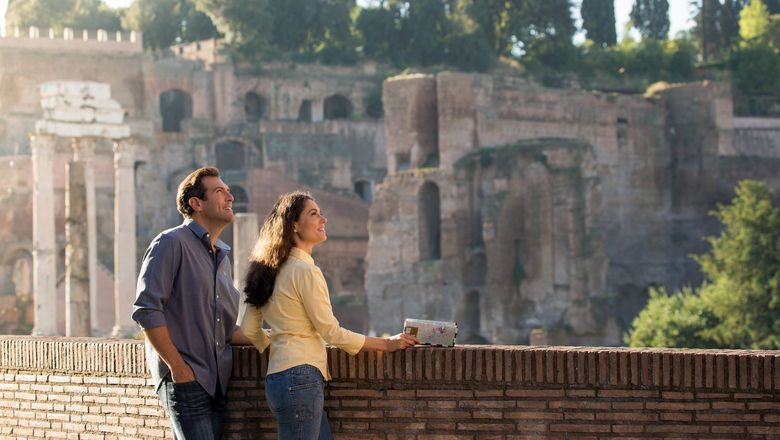 Tourists at the Roman ruins in Rome.