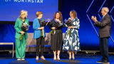 After Vacation Planners president Jenn Lee, second from right, was named godmother of AmaWaterways' AmaSintra, other AmaWaterways godmothers took the stage. From left, Cruise Planners' Michelle Fee, Jackie Friedman of Nexion and Debbie Fiorino of Dream Vacations and Cruise One. Alex Pinelo of AmaWaterways is at the right.