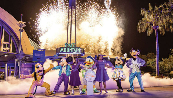 Mickey Mouse and friends, including Walt Disney World ambassadors Shannon Smith-Conrad and Serena Arvizu, celebrating the 50th anniversary of Space Mountain.