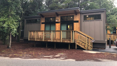 The modern cabins at Fort Wilderness Resort and Campground have clerestory windows to provide natural light. The shed-style cabins come in a handful of colors.