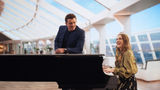 Drew Barrymore and Orlando Bloom play vacationers aboard the MSC World America who have commandeered the piano in the MSC Yacht Club's Top Sail Lounge.