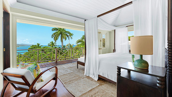 One of Villa 14's bedrooms, which has a chic Caribbean decor.