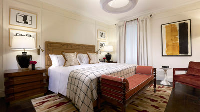 A suite bedroom at The Carlton Milan.