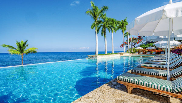 The Round Hill Hotel and Villas infinity pool overlooks the resort's private beach.