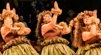 A hula troupe performs hula kahiko, or ancient style of hula, at the Merrie Monarch Festival.