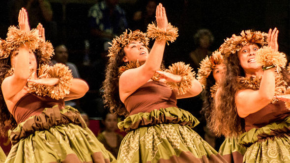 A hula troupe performs hula kahiko, or ancient style of hula, at the Merrie Monarch Festival.